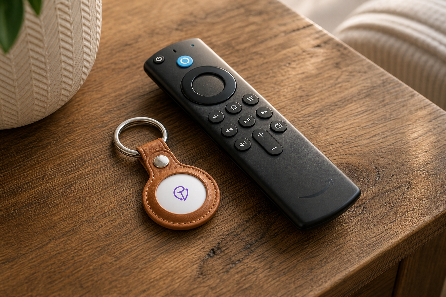 Tracker Mist fob attached to a TV remote beside a couch